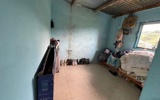 Propiedad con solar a bordo de calle